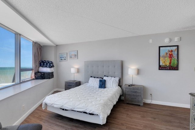 1515 Boardwalk Unit 1004, Atlantic City, NJ 08401 - bedroom with a textured ceiling, wood finished floors, and baseboards