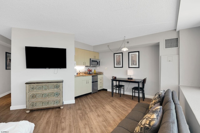 1515 Boardwalk Unit 1004, Atlantic City, NJ 08401 - living area featuring light wood finished floors, baseboards, and a textured ceiling
