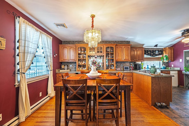 6 Holly Dr, Northfield, NJ 08225 - dining space featuring a chandelier and baseboard heating