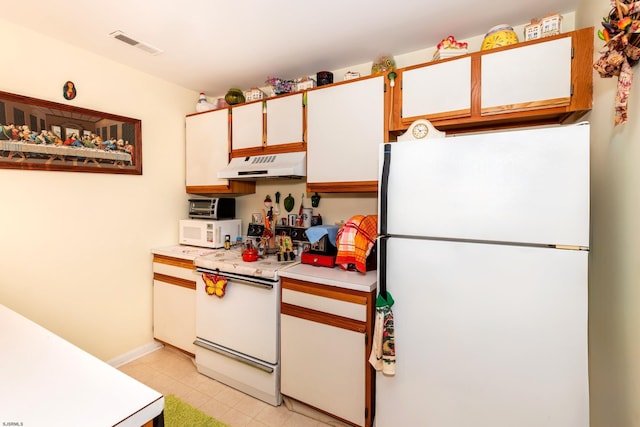 32 Malibu Way Unit 32, Galloway Township, NJ 08205 - kitchen featuring white appliances, under cabinet range hood, light countertops, light tile patterned floors, and baseboards