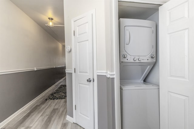 4825 Atlantic Ave Unit 3, Ventnor, NJ 08406 - laundry room with stacked washer and clothes dryer, light wood-type flooring, and baseboards