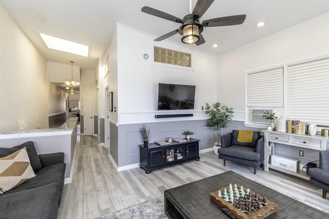 4825 Atlantic Ave Unit 3, Ventnor, NJ 08406 - living area featuring light wood-style flooring, a chandelier, a ceiling fan, recessed lighting, and a skylight