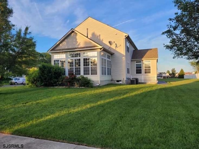 1599 Cherokee Ln, Vineland, NJ 08361 - back of house with a lawn and central AC unit