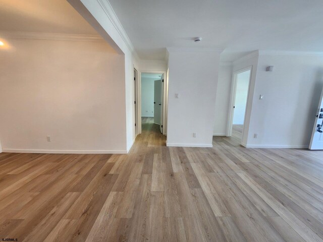 159 Heather Croft Unit 159, Egg Harbor Township, NJ 08234 - unfurnished living room with ornamental molding, light wood-style floors, and baseboards