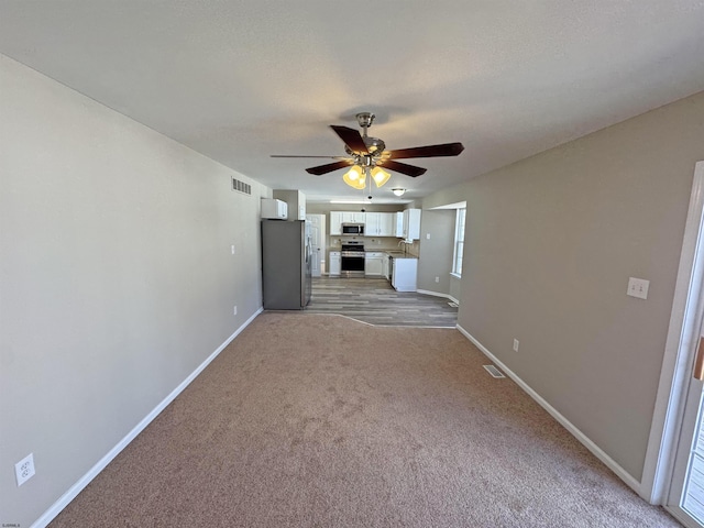 7 Nevis Dr, Egg Harbor Township, NJ 08234 - unfurnished living room with light colored carpet, baseboards, and a ceiling fan