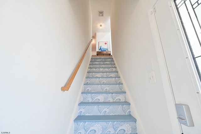 289 40th St Unit B, Brigantine, NJ 08203 - stairway featuring healthy amount of natural light and carpet floors