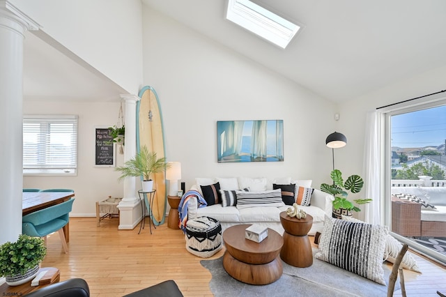 289 40th St Unit B, Brigantine, NJ 08203 - living room featuring light wood-style flooring, high vaulted ceiling, a skylight, and baseboards