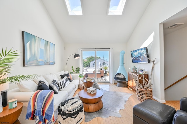 289 40th St Unit B, Brigantine, NJ 08203 - living room with a skylight, wood finished floors, and high vaulted ceiling