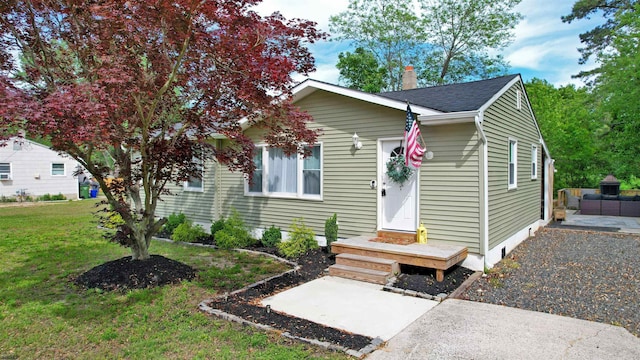 82 Robert Best Rd, Egg Harbor Township, NJ 08234 - view of front facade featuring a front lawn, a chimney, a patio, and roof with shingles
