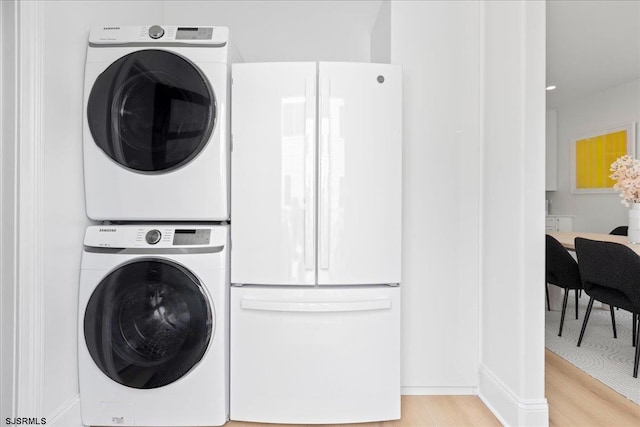 1A N Douglas Ave, Margate, NJ 08402 - laundry area with stacked washer / drying machine and light wood-type flooring