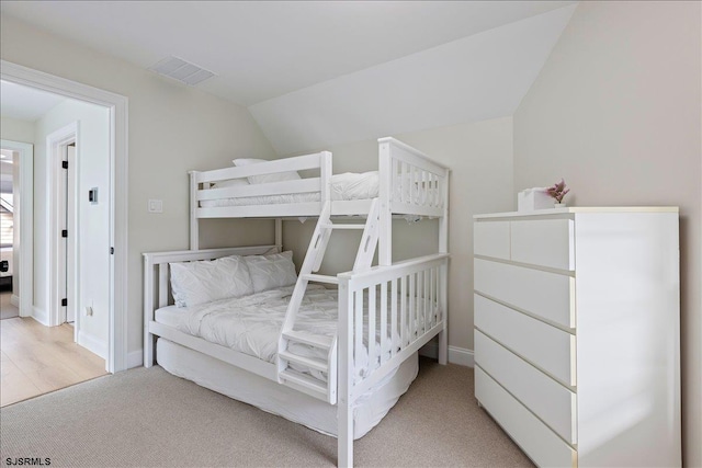 1A N Douglas Ave, Margate, NJ 08402 - bedroom with lofted ceiling, baseboards, and light colored carpet
