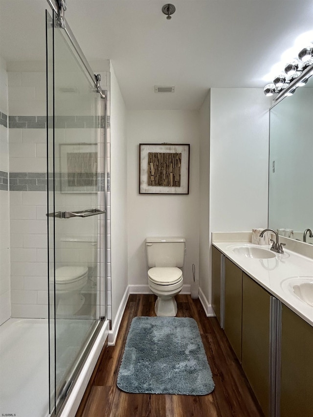 3101 Boardwalk Unit 1204-1, Atlantic City, NJ 08401 - bathroom with toilet, a shower stall, wood finished floors, and double vanity