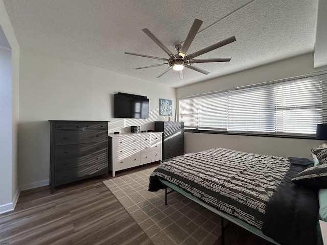 3101 Boardwalk Unit 1204-1, Atlantic City, NJ 08401 - bedroom featuring dark wood-type flooring, a textured ceiling, a ceiling fan, and baseboards