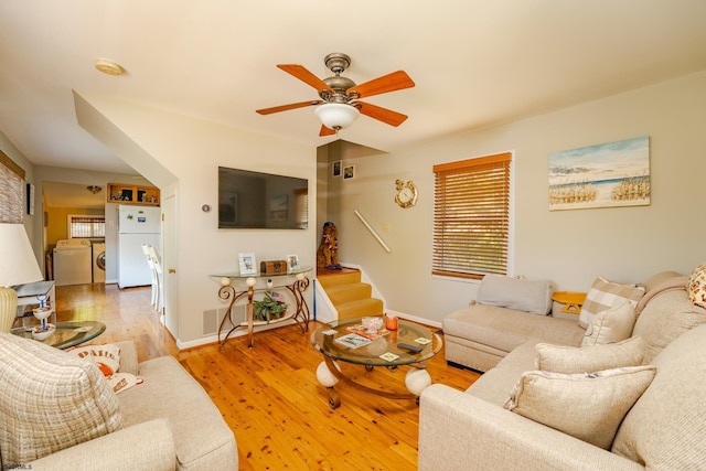 202 Steelman Ave, Somers Point, NJ 08244 - living area featuring plenty of natural light, a ceiling fan, washing machine and clothes dryer, and wood finished floors