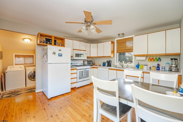 202 Steelman Ave, Somers Point, NJ 08244 - kitchen featuring washer and clothes dryer, white appliances, light wood finished floors, ceiling fan, and light countertops