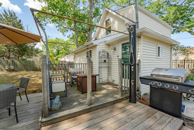 202 Steelman Ave, Somers Point, NJ 08244 - wooden terrace with outdoor dining space, grilling area, and a fenced backyard