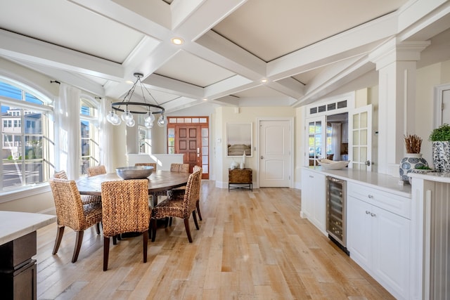 25 S Union Ave, Margate, NJ 08402 - dining area with wine cooler, beam ceiling, baseboards, light wood finished floors, and coffered ceiling