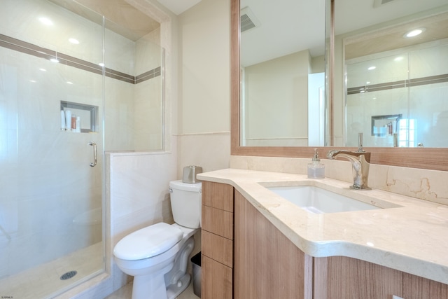 25 S Union Ave, Margate, NJ 08402 - bathroom featuring toilet, vanity, a stall shower, and tile walls