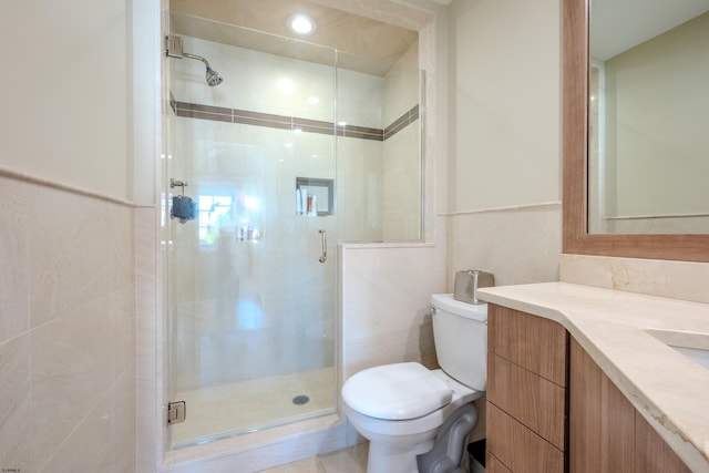 25 S Union Ave, Margate, NJ 08402 - bathroom with toilet, tile walls, vanity, and a stall shower
