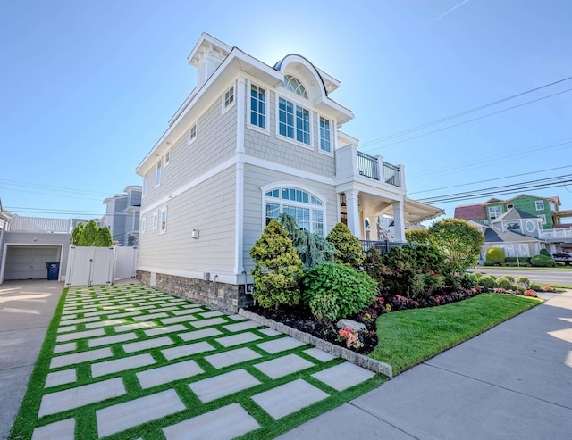 25 S Union Ave, Margate, NJ 08402 - view of front of property with a gate, a balcony, and concrete driveway