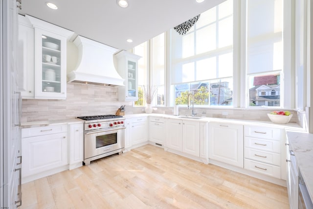 25 S Union Ave, Margate, NJ 08402 - kitchen featuring premium stove, premium range hood, a sink, backsplash, and recessed lighting
