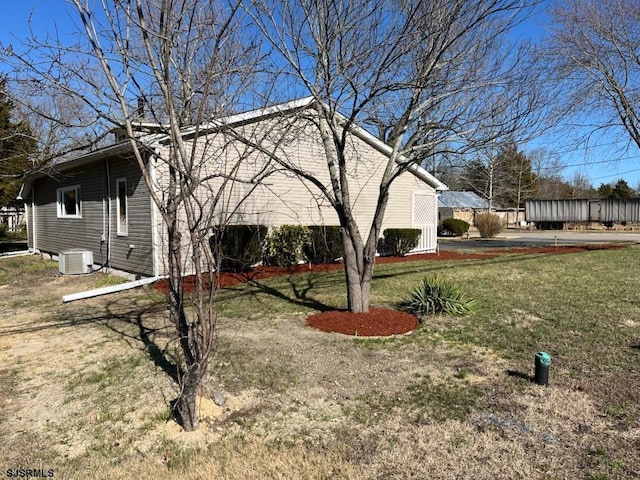 909 W White Horse Pike, Galloway Township, NJ 08215 - view of side of home featuring central air condition unit and a lawn