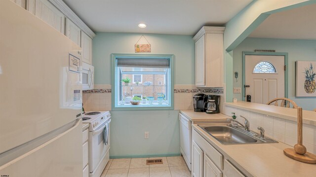 1312 Ocean Ave Unit 1, Ocean City, NJ 08226 - kitchen with white appliances, a sink, light countertops, tasteful backsplash, and recessed lighting