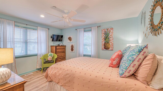 1312 Ocean Ave Unit 1, Ocean City, NJ 08226 - bedroom with multiple windows, wood finished floors, baseboards, ceiling fan, and recessed lighting