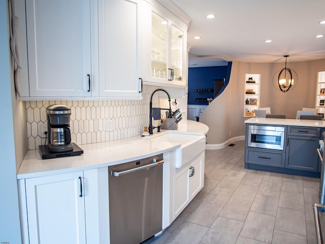 2608 Oberon Ave, Longport, NJ 08403 - kitchen featuring stainless steel dishwasher, a sink, built in microwave, backsplash, and white cabinetry