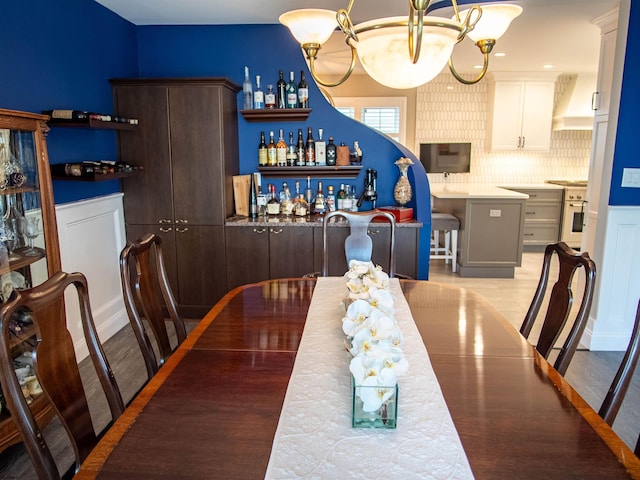 2608 Oberon Ave, Longport, NJ 08403 - dining room with a chandelier and light wood-style floors