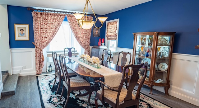 2608 Oberon Ave, Longport, NJ 08403 - dining room featuring a wainscoted wall, a decorative wall, a chandelier, and wood finished floors