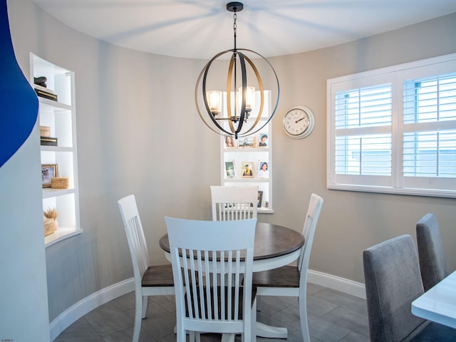 2608 Oberon Ave, Longport, NJ 08403 - tiled dining space with a chandelier and baseboards