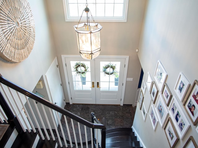 2608 Oberon Ave, Longport, NJ 08403 - entrance foyer featuring a towering ceiling, stairs, french doors, and carpet
