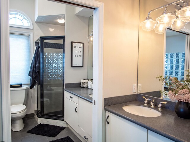 2608 Oberon Ave, Longport, NJ 08403 - bathroom featuring vanity, a shower stall, tile patterned floors, and toilet