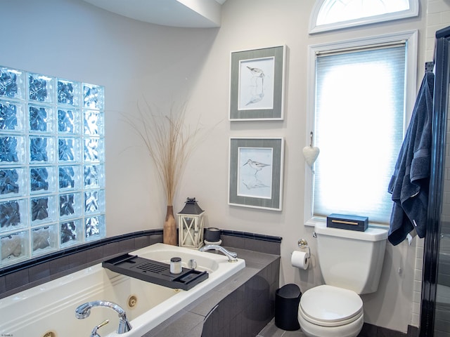 2608 Oberon Ave, Longport, NJ 08403 - bathroom featuring toilet, a tub with jets, and plenty of natural light