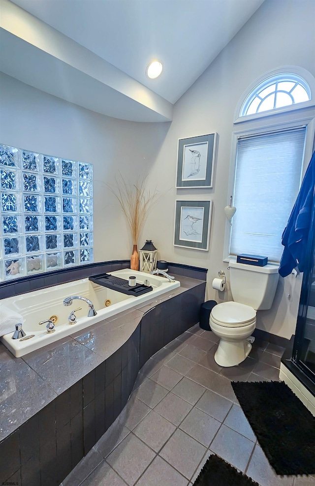 2608 Oberon Ave, Longport, NJ 08403 - full bathroom with lofted ceiling, tile patterned floors, toilet, and a jetted tub