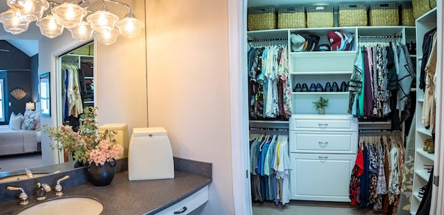 2608 Oberon Ave, Longport, NJ 08403 - bathroom with vanity, a walk in closet, and a chandelier