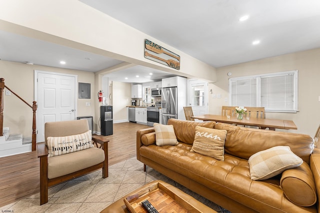 1907 Kuehnle Ave, Atlantic City, NJ 08401 - living area featuring light wood-style flooring, electric panel, stairway, recessed lighting, and baseboards