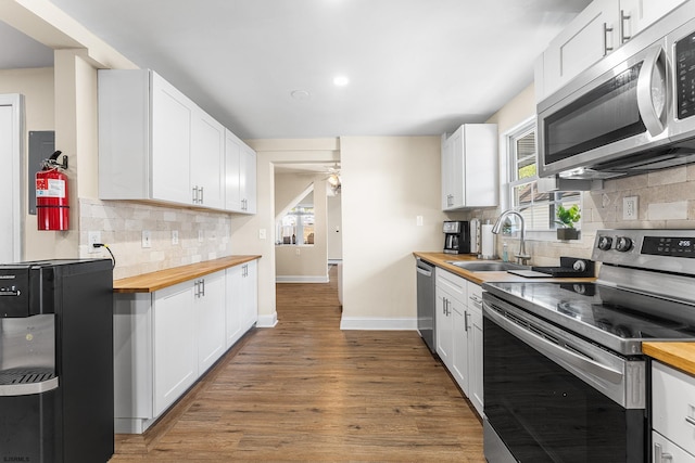 1907 Kuehnle Ave, Atlantic City, NJ 08401 - kitchen with wooden counters, appliances with stainless steel finishes, a sink, and ceiling fan