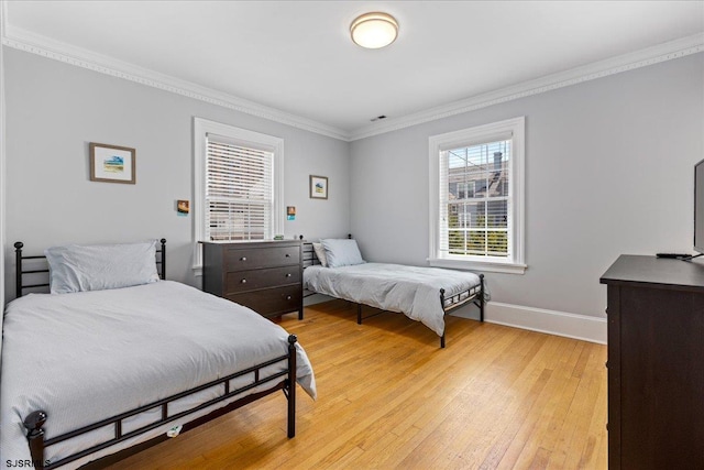 103 S Austin Ave, Ventnor, NJ 08406 - bedroom with light wood-style flooring, ornamental molding, and baseboards