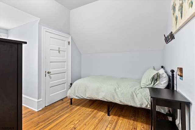 103 S Austin Ave, Ventnor, NJ 08406 - bedroom featuring wood finished floors, vaulted ceiling, and baseboards