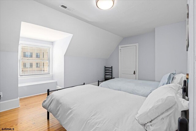 103 S Austin Ave, Ventnor, NJ 08406 - bedroom with vaulted ceiling, wood finished floors, and baseboards