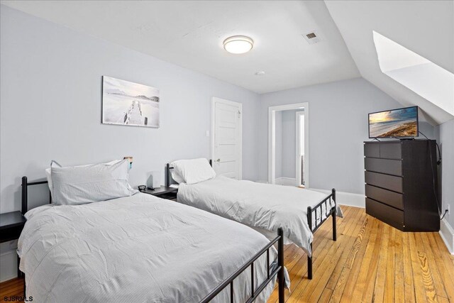 103 S Austin Ave, Ventnor, NJ 08406 - bedroom with light wood-style floors, baseboards, and lofted ceiling