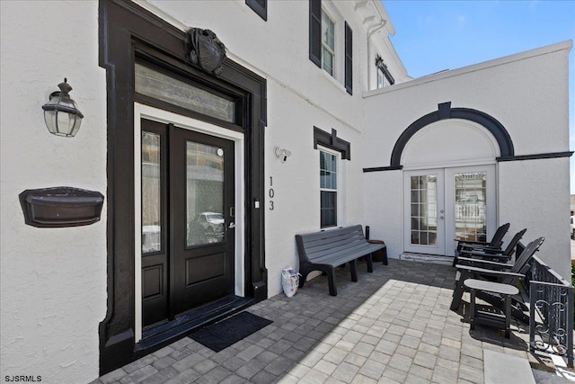 103 S Austin Ave, Ventnor, NJ 08406 - property entrance with french doors and stucco siding