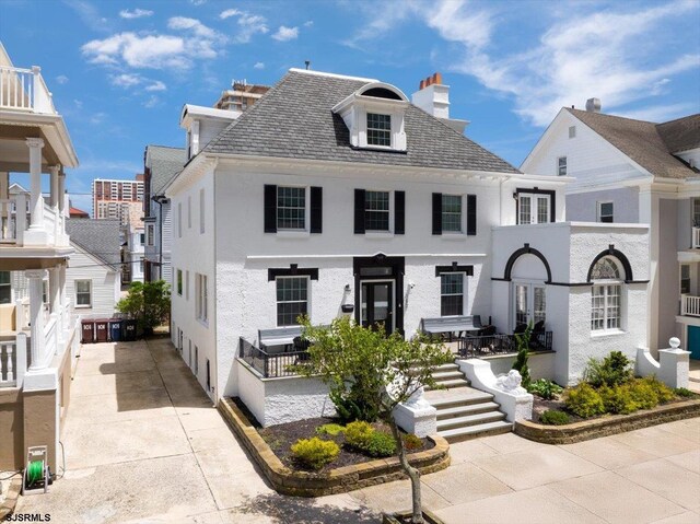 103 S Austin Ave, Ventnor, NJ 08406 - view of front facade featuring stucco siding and a chimney