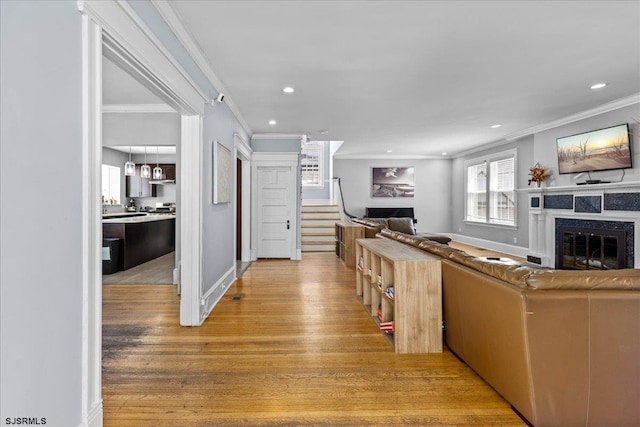 103 S Austin Ave, Ventnor, NJ 08406 - living room featuring a glass covered fireplace, crown molding, light wood finished floors, stairway, and recessed lighting