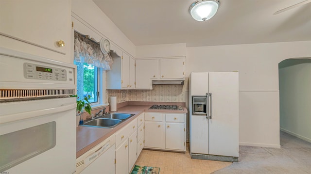 205 Ridgewood Dr, Northfield, NJ 08225 - kitchen with white appliances, a sink, under cabinet range hood, and white cabinetry