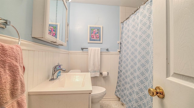 205 Ridgewood Dr, Northfield, NJ 08225 - bathroom featuring toilet, a wainscoted wall, vanity, tile patterned flooring, and a shower with shower curtain