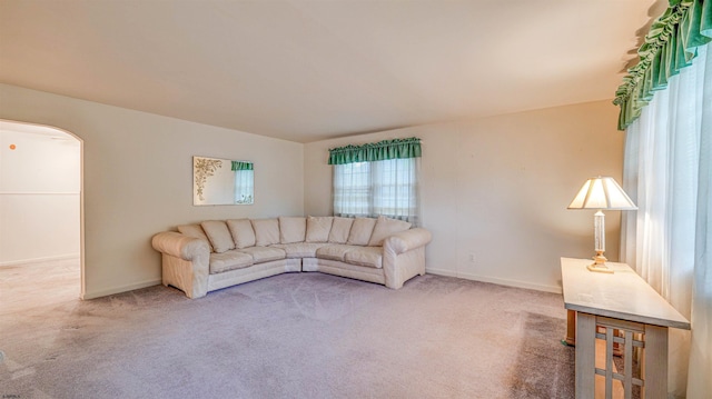 205 Ridgewood Dr, Northfield, NJ 08225 - carpeted living room featuring baseboards and arched walkways