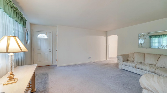 205 Ridgewood Dr, Northfield, NJ 08225 - living area featuring carpet, arched walkways, and baseboards